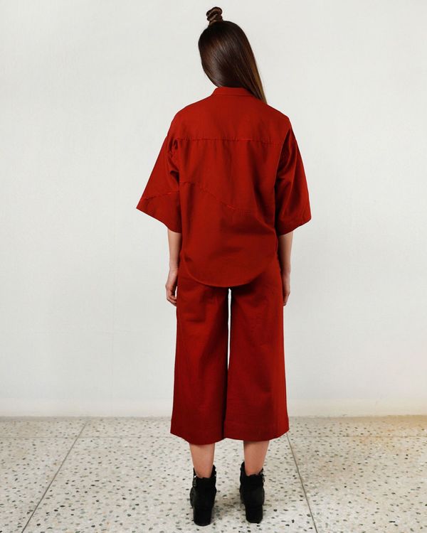 red pleated pants
