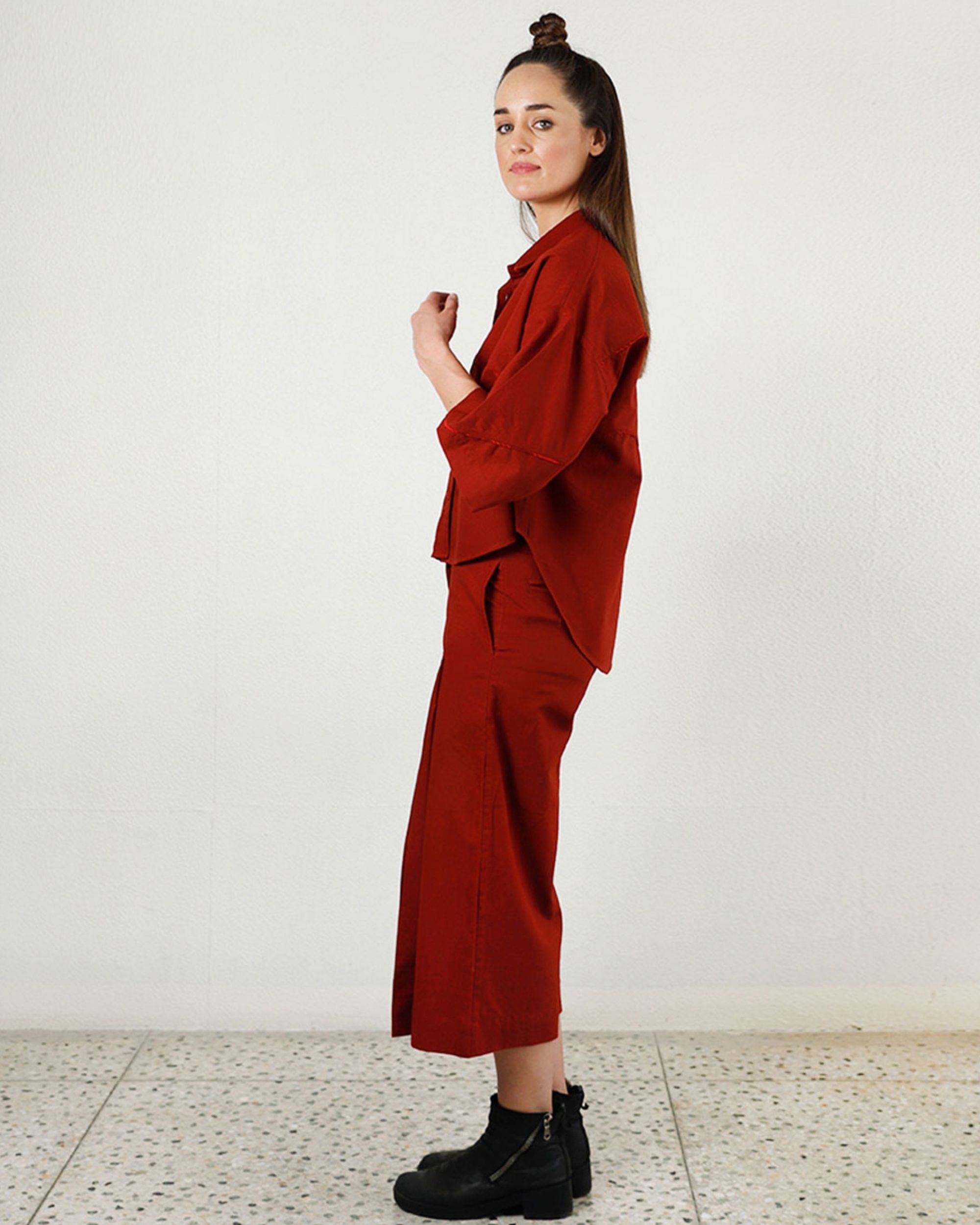 red pleated pants
