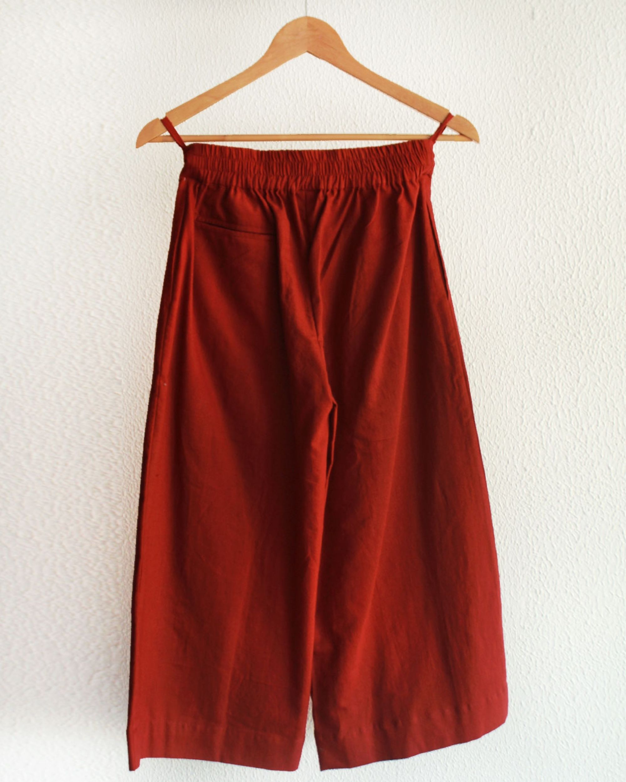 Cherry red pleated pants by Rias | The Secret Label