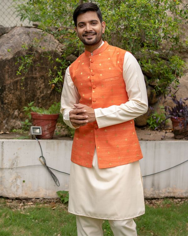 Orange chanderi cotton polka dotted nehru jacket with off white kurta and pyjama - set of three 1