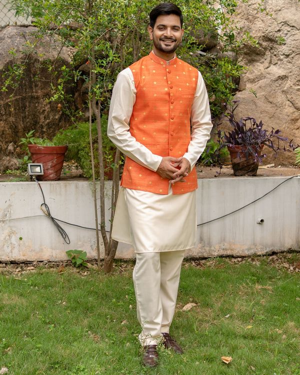 Orange chanderi cotton polka dotted nehru jacket with off white kurta and pyjama - set of three 2