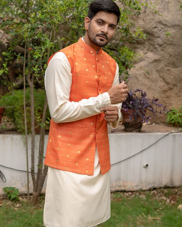 Orange chanderi cotton polka dotted nehru jacket with off white kurta and pyjama - set of three 4