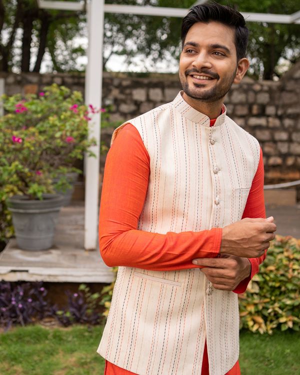 Beige striped nehru jacket with orange kurta and pyjama - set of three 1