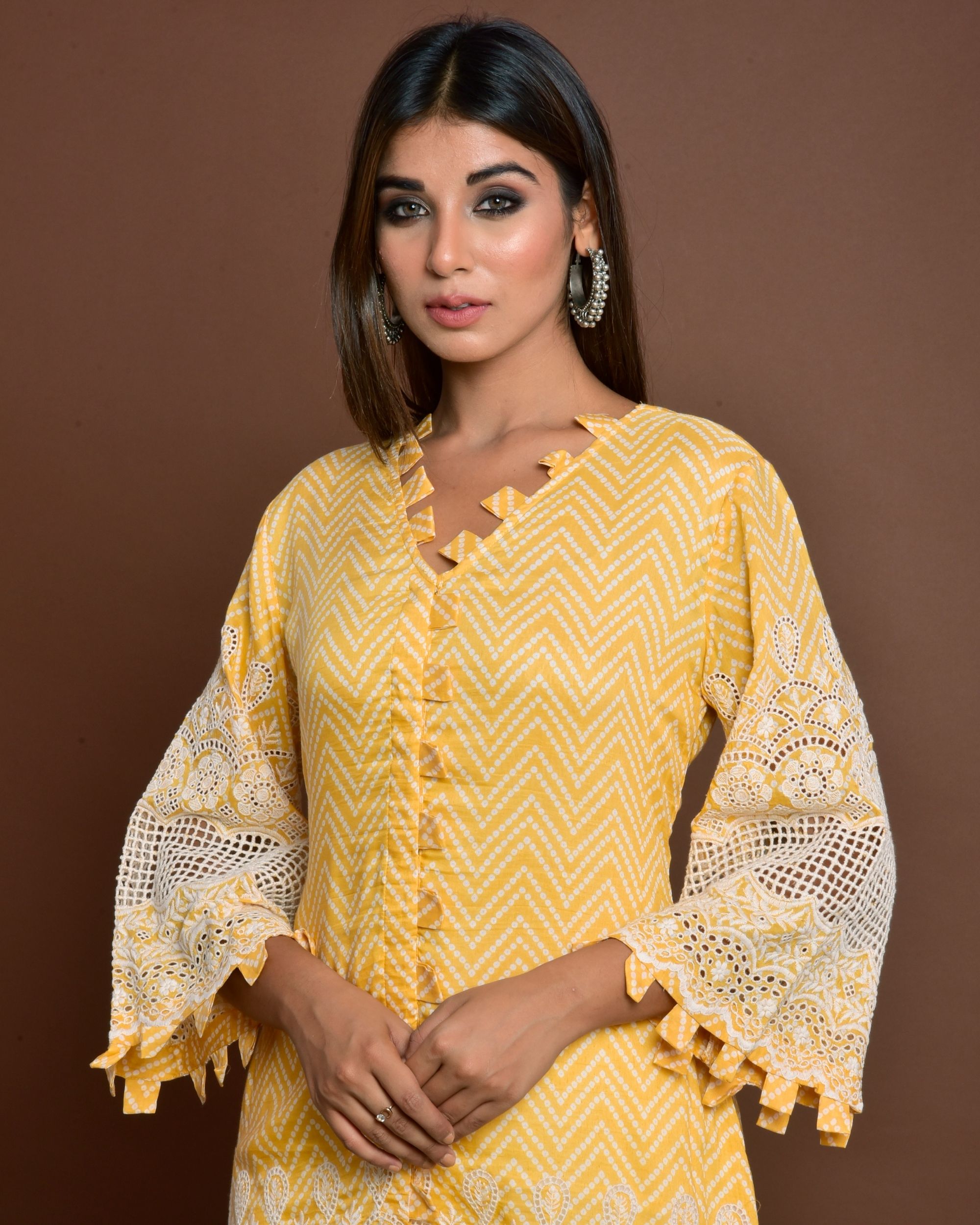 Yellow cutwork embroidery kurta and off white tulip pants