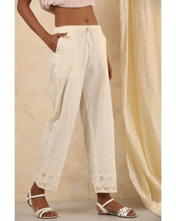 White cotton pants with embroidered detailing at hem 2