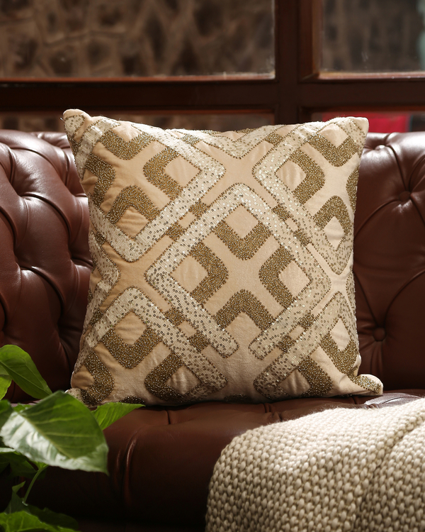 Beige accent cushion cover with geometric embellishments 3