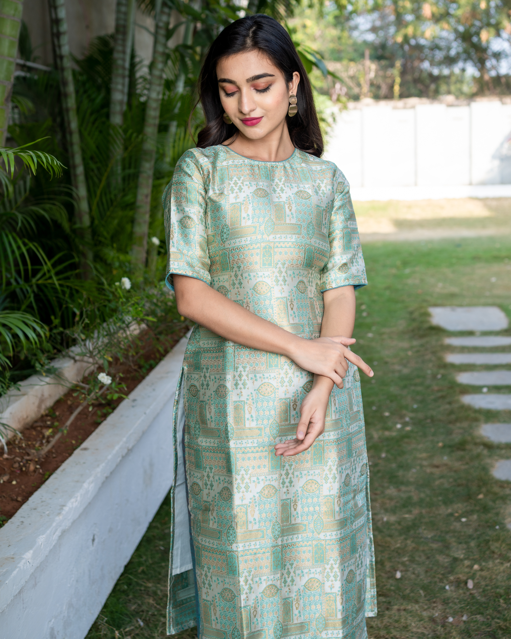 green brocade suit