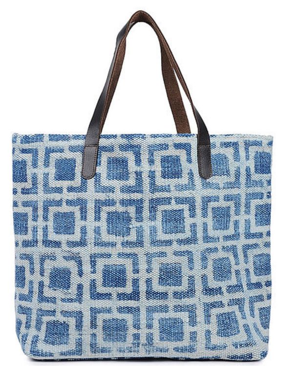 Indigo hand-printed cotton rug and leather tote 1