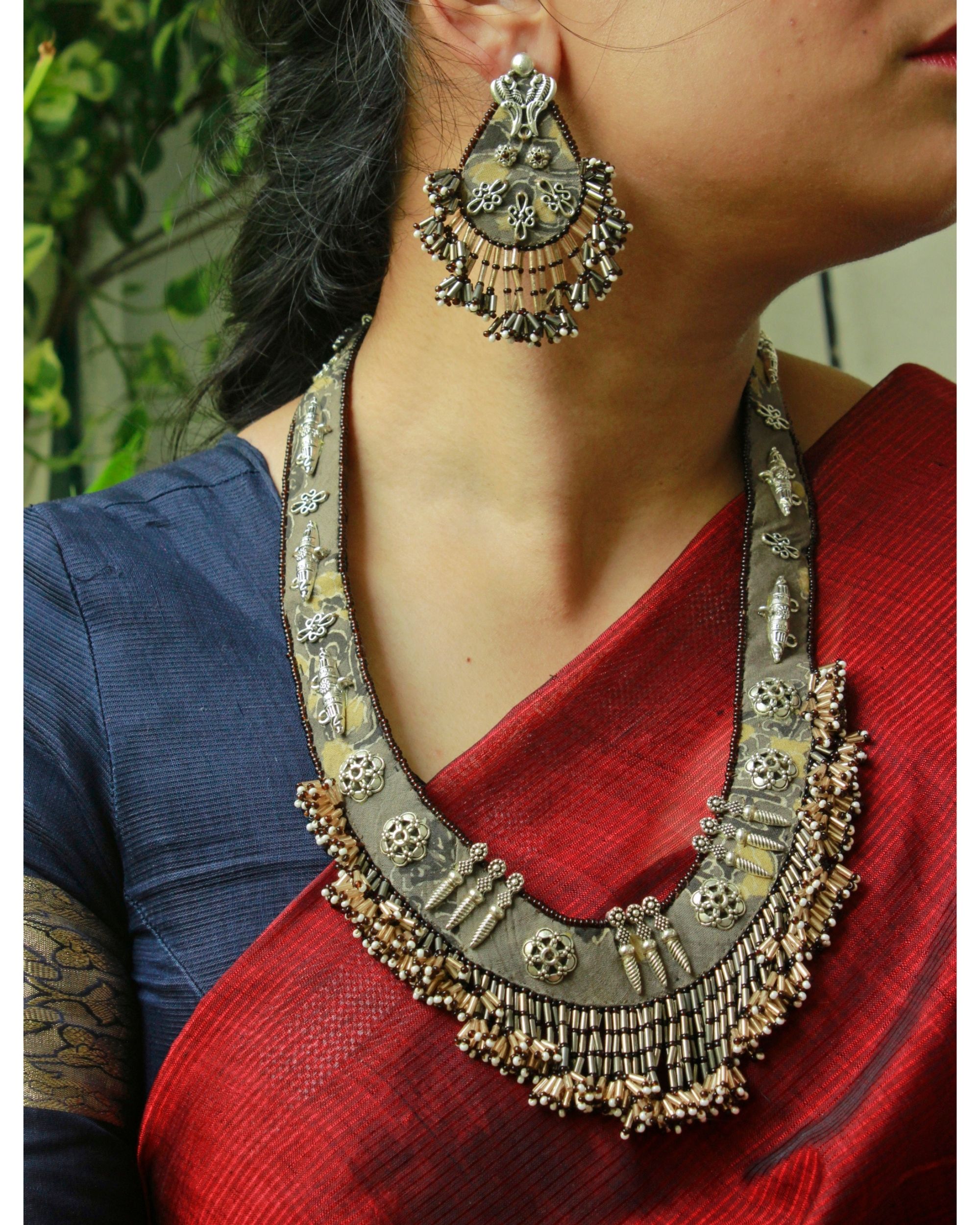 Beige metal embellished beaded long neckpiece with earrings set