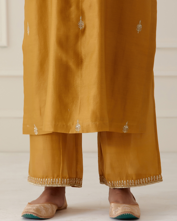 Mustard yellow Embroidered kurta with palazzo set of two by Ikshita
