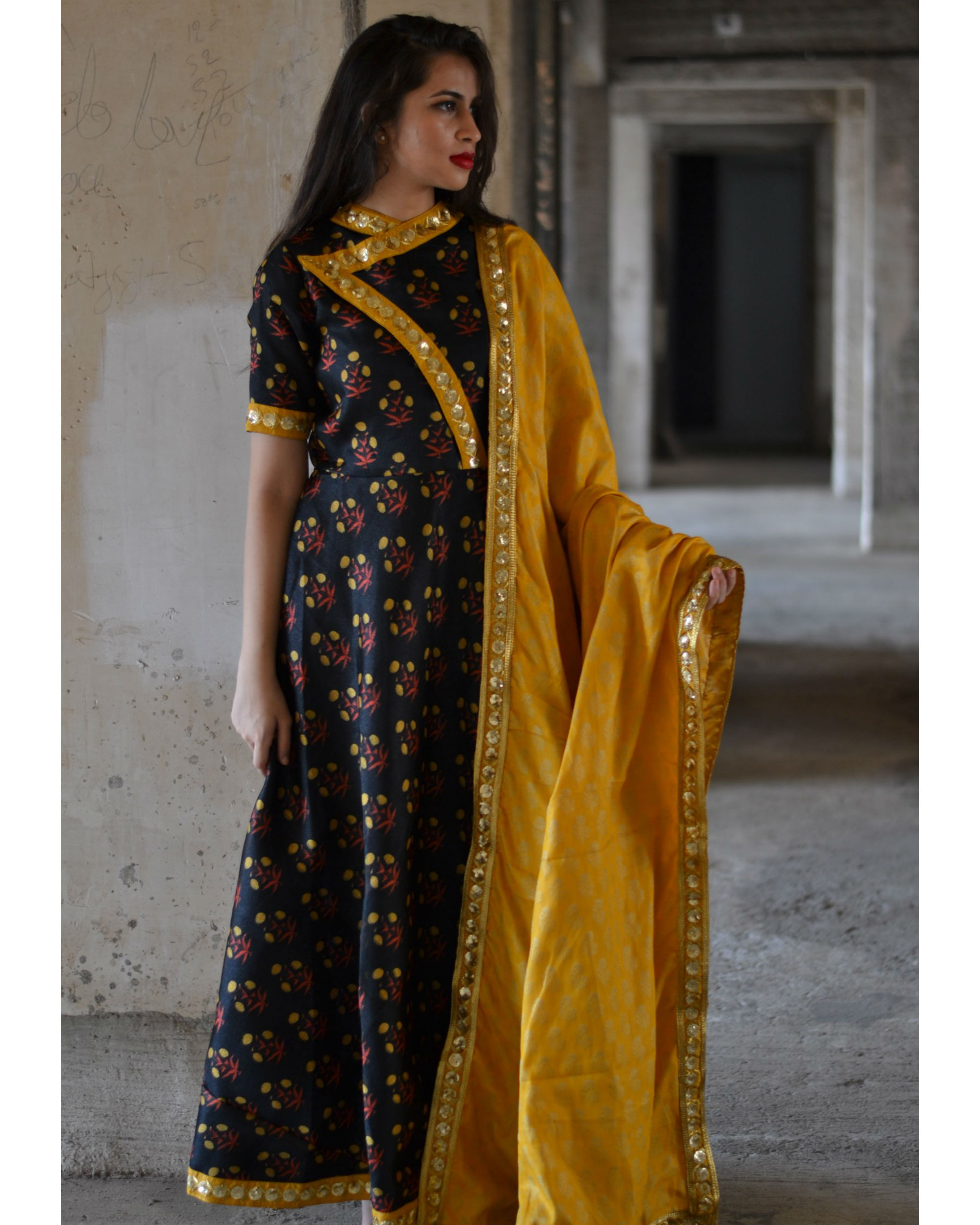 Black dress shop with yellow dupatta