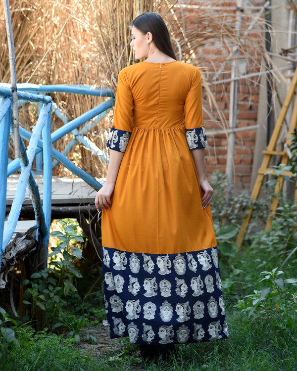 Orange rust gathered dress with kalamkari border by Desi Doree | The ...
