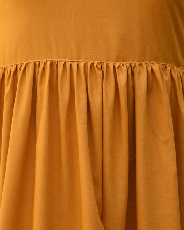 Orange rust gathered dress with kalamkari border by Desi Doree | The ...